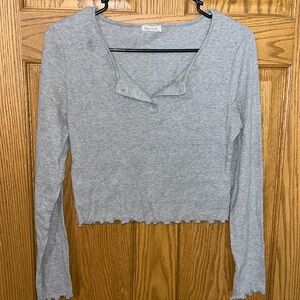 Grey ribbed Long sleeve crop top. Small stain near collar see picture. No tears.
